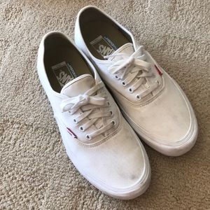 Lightly worn, white Vans